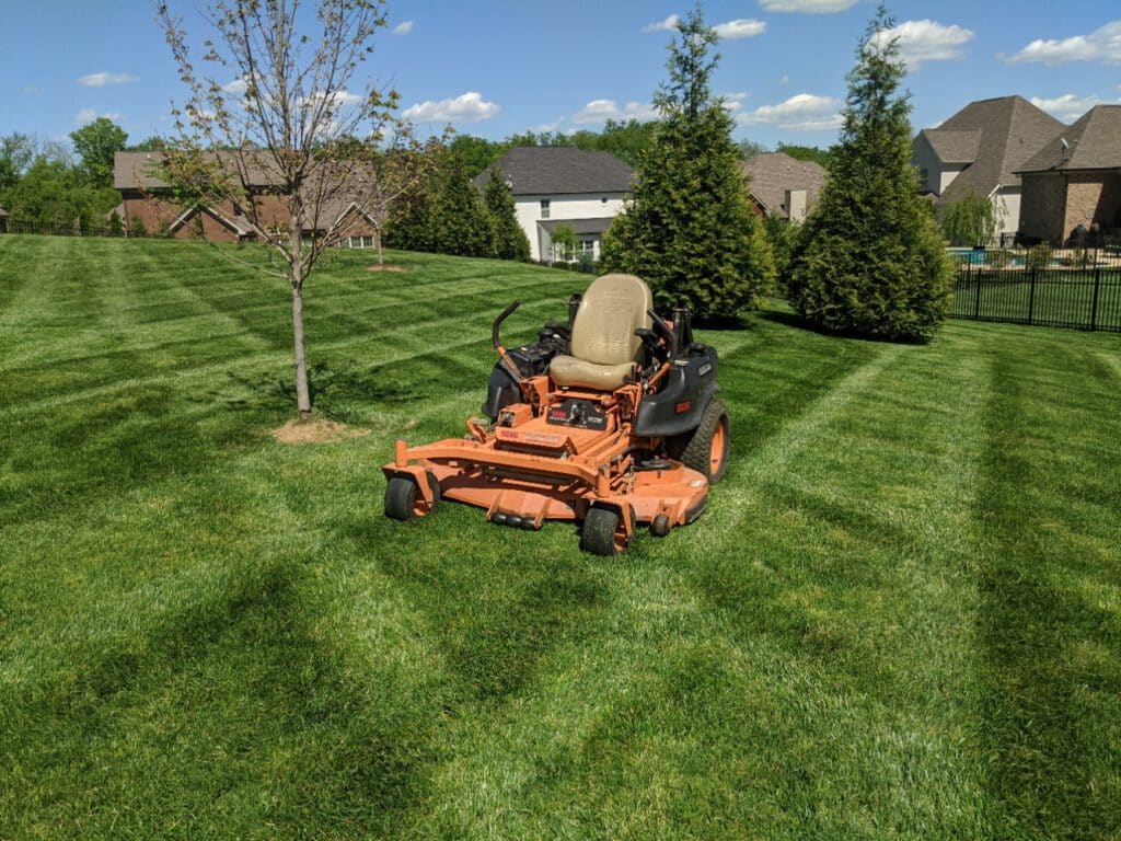 scag mower mowing grass in thompson's station, tn
